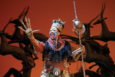 Phindile Mkhize as “Rafiki” in the opening number “The Circle of Life” Photo by Joan Marcus