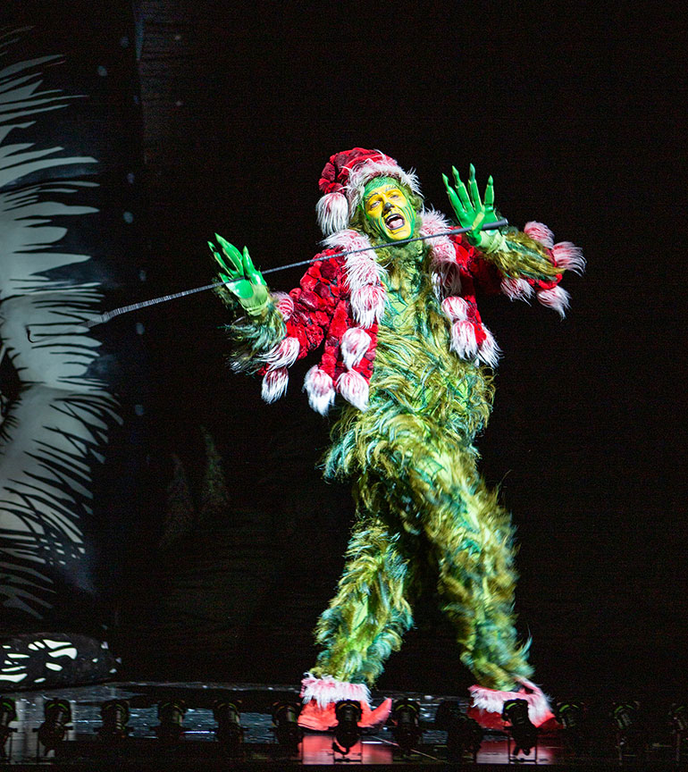 Edward Watts as The Grinch in Dr. Seuss’s “How the Grinch Stole Christmas!”, book and lyrics by Timothy Mason, music by Mel Marvin, original production conceived and directed by Jack O'Brien, original choreography by John DeLuca, and directed by James Vásquez, running now through Dec. 29 at The Old Globe. (Photo by Jim Cox)